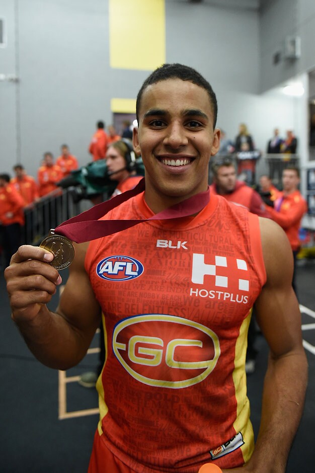 AFL 2016 Rd 16 - Gold Coast v Brisbane GOLD COAST, AUSTRALIA - JULY 09: Touk Miller of the Suns holds the Marcus Ashcroft medal during the 2016 AFL Round 16 match between the Gold Coast Suns and the Brisbane Lions at Metricon Stadium on July 9, 2016 in Gold Coast, Australia. (Photo by Matt Roberts/AFL Media)